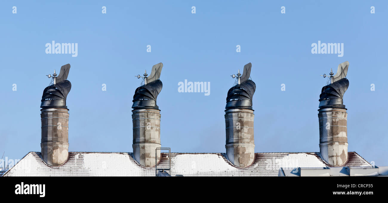 Wind vanes or cowls which are used for drying and airing the malt in the underlying oast house by means of suction and negative Stock Photo
