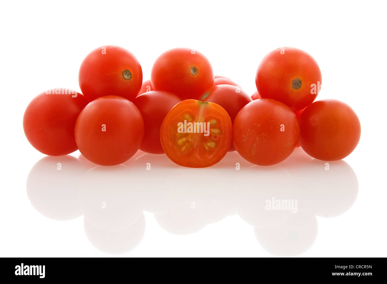 pile of cherry tomatoes on white background Stock Photo - Alamy