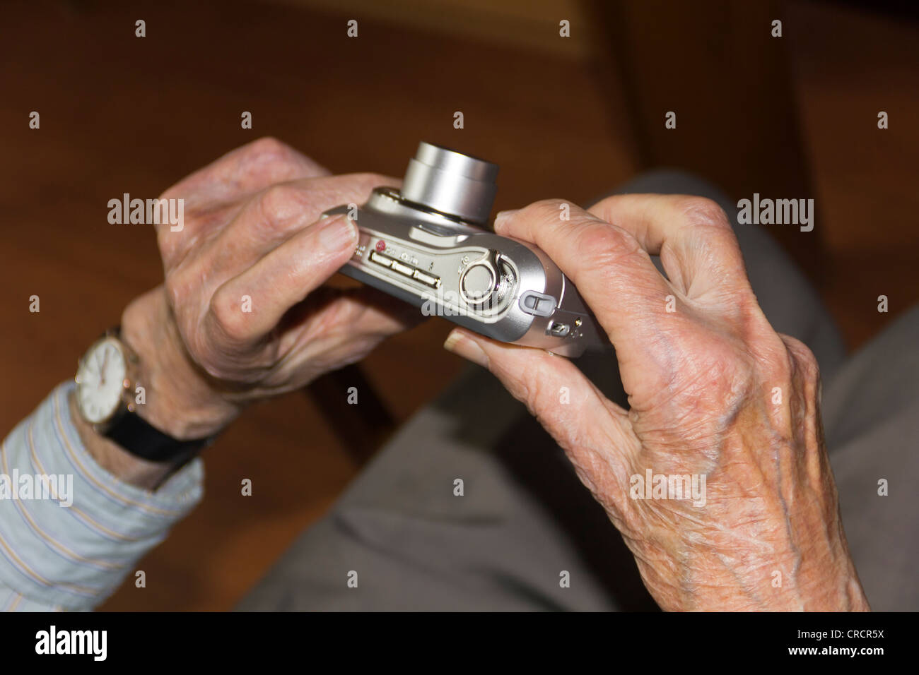 Old person's hands holding a digital camera, nursing home, retirement home, Berlin, Germany, Europ Stock Photo