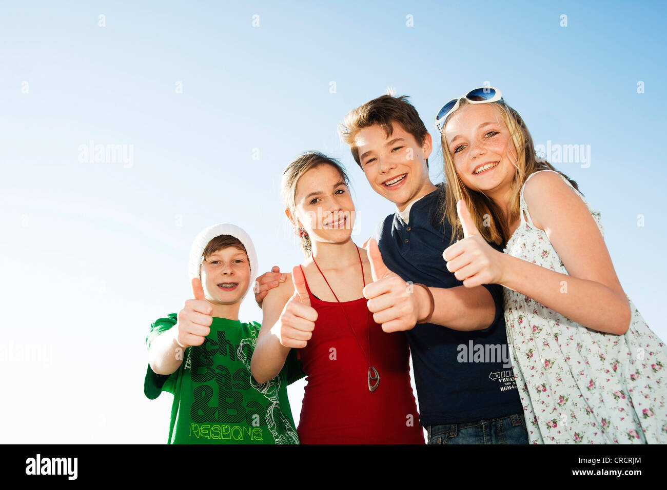 Four happy teenage friends outdoors Stock Photo