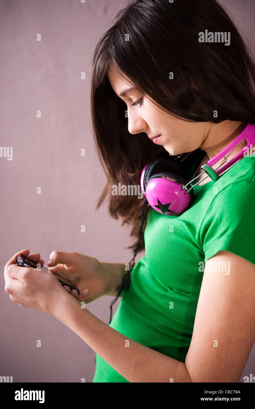 Teenage girl looking at cell phone Stock Photo