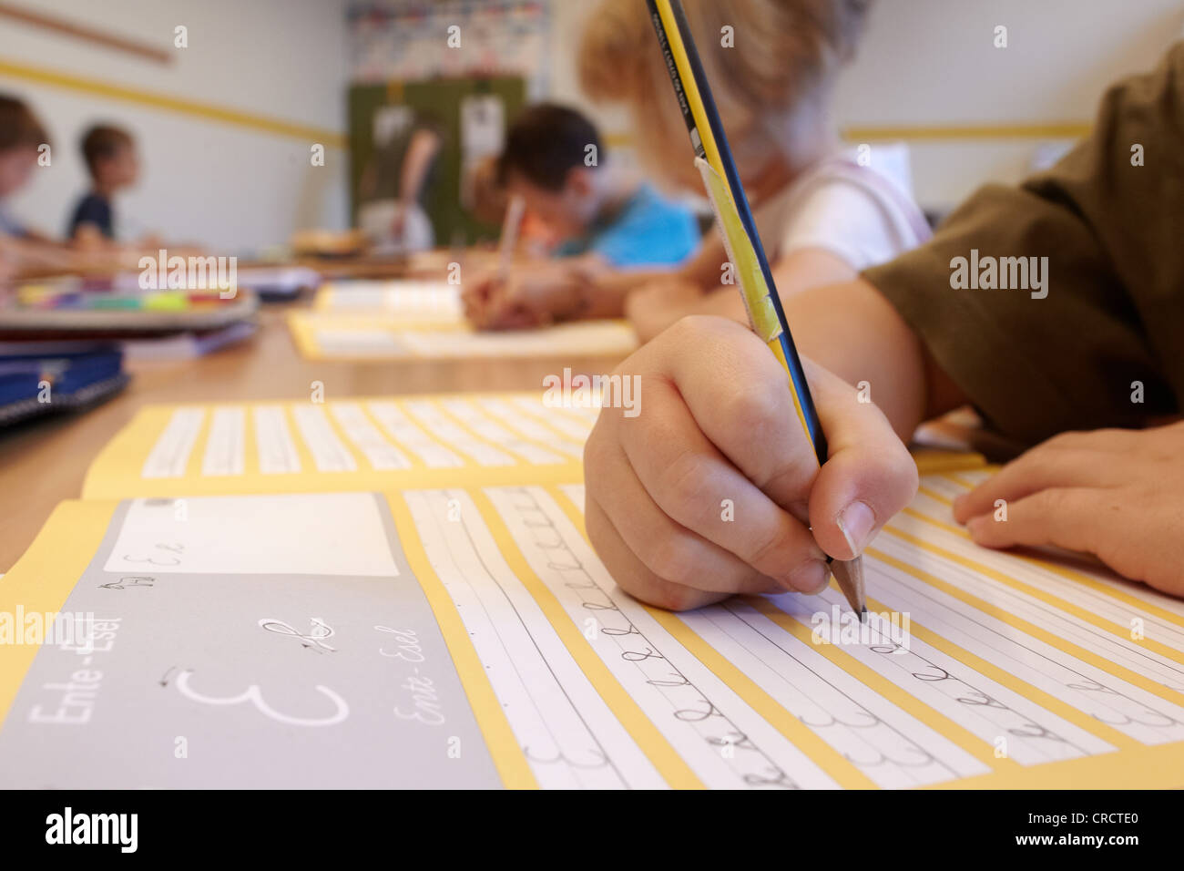 Students of the second grade of elementary school learning how to write, cursive handwriting, Niederwerth, Rhineland-Palatinate Stock Photo