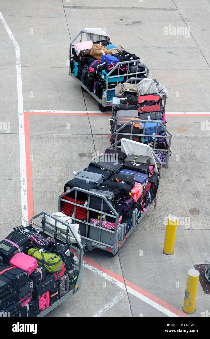Baggage trucks, Birmingham Airport, West Midlands, England, UK, Western