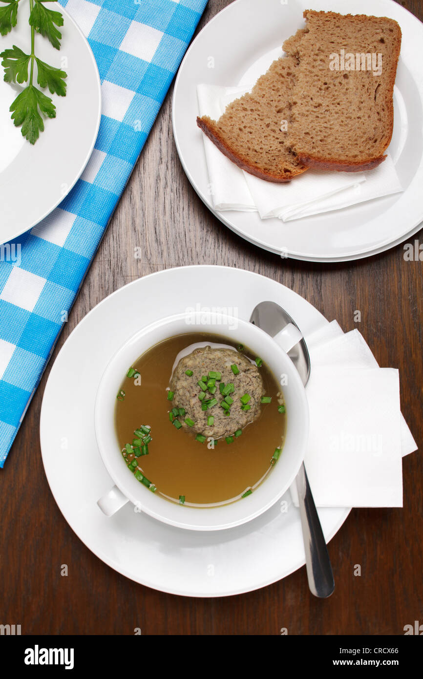 Liver dumplings in beef broth, sprinkled with chives, and bread Stock
