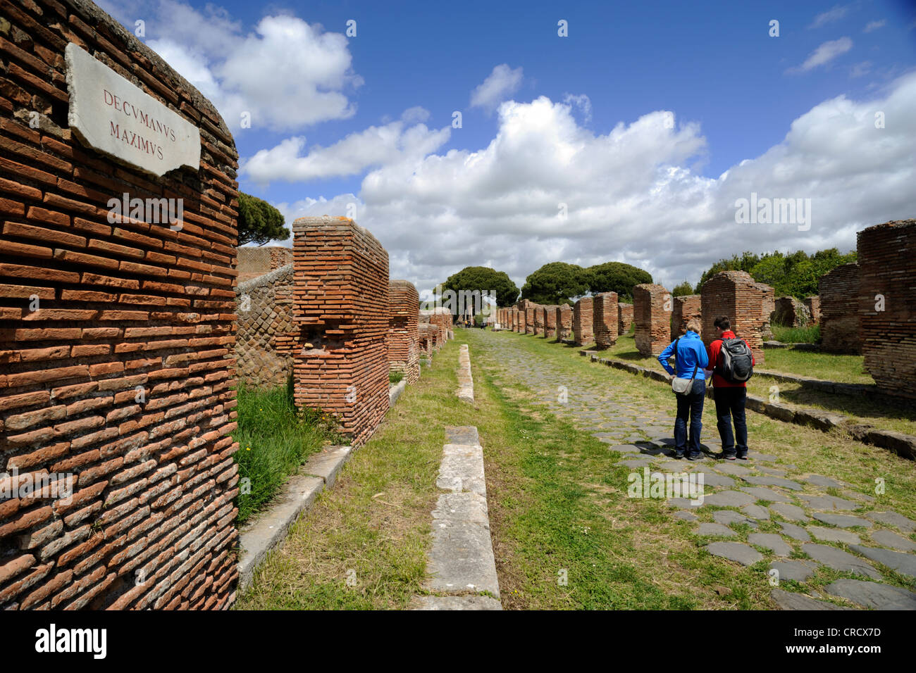 Italy, Rome, Ostia Antica, decumanus maximus, roman road, tourists Stock Photo