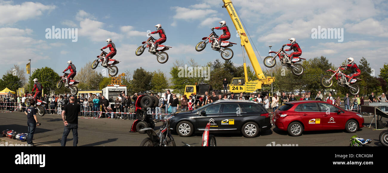 Motorcycle stuntman Mike Auffenberg jumping over cars with his cross machine, Koblenz, Rhineland-Palatinate, Germany, Europe Stock Photo