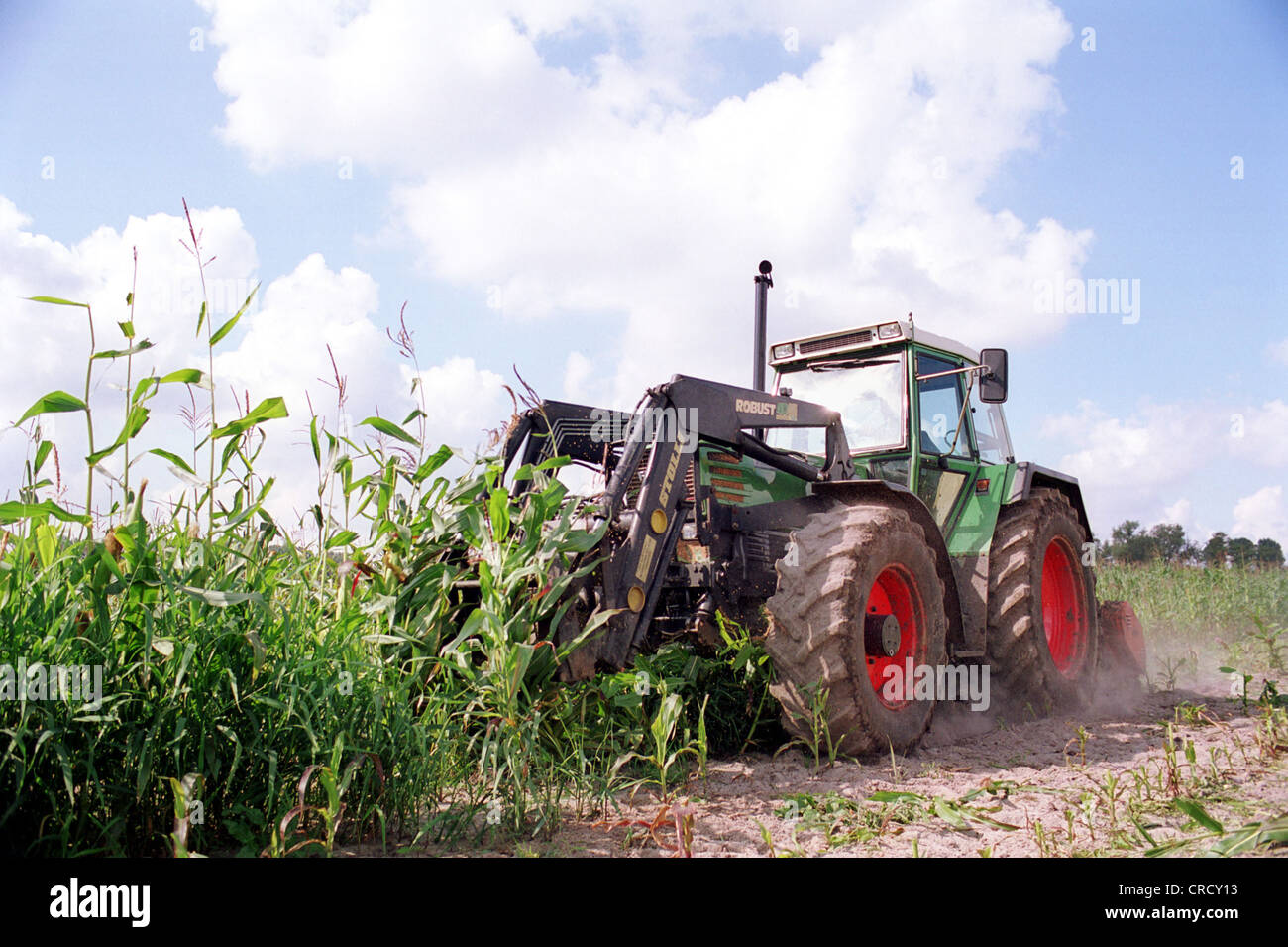 Farmer when plowing with the tractor Stock Photo - Alamy