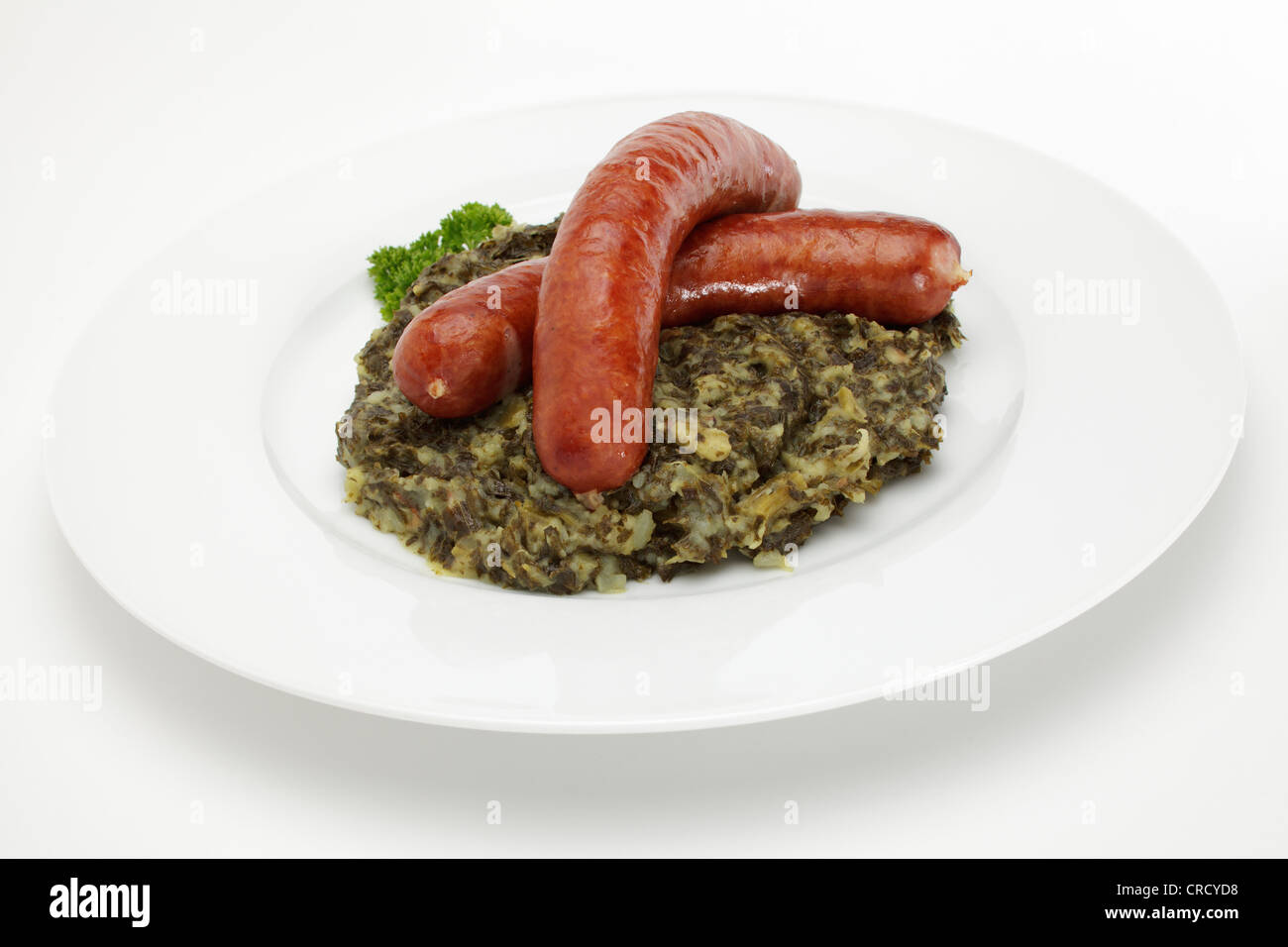 Mettwurst smoked sausages on green cabbage Stock Photo