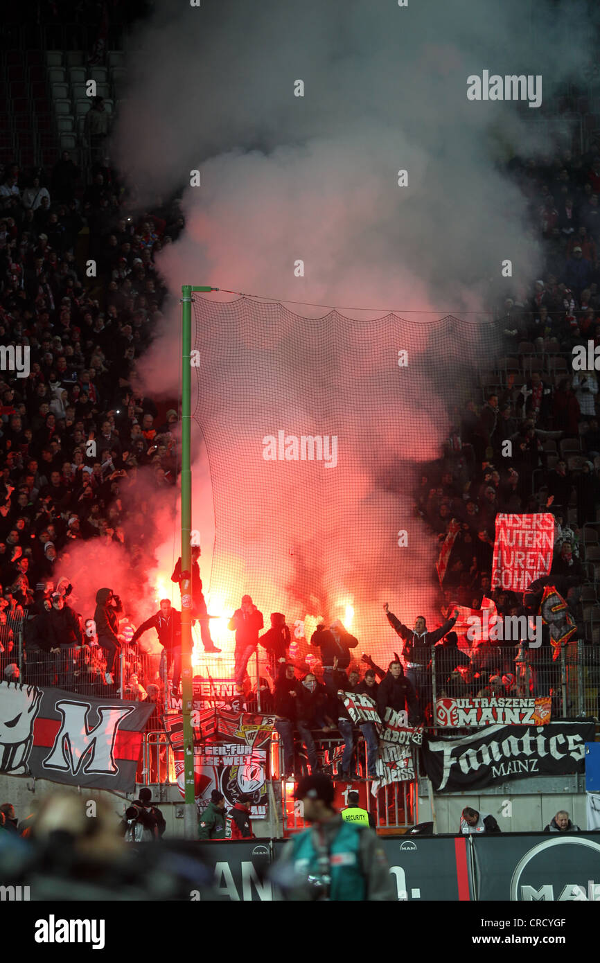 Mainz fans in the stands with ignited fireworks, football Bundesliga 1. FC Kaiserslautern - FSV Mainz 05, Fritz-Walter-Stadion Stock Photo