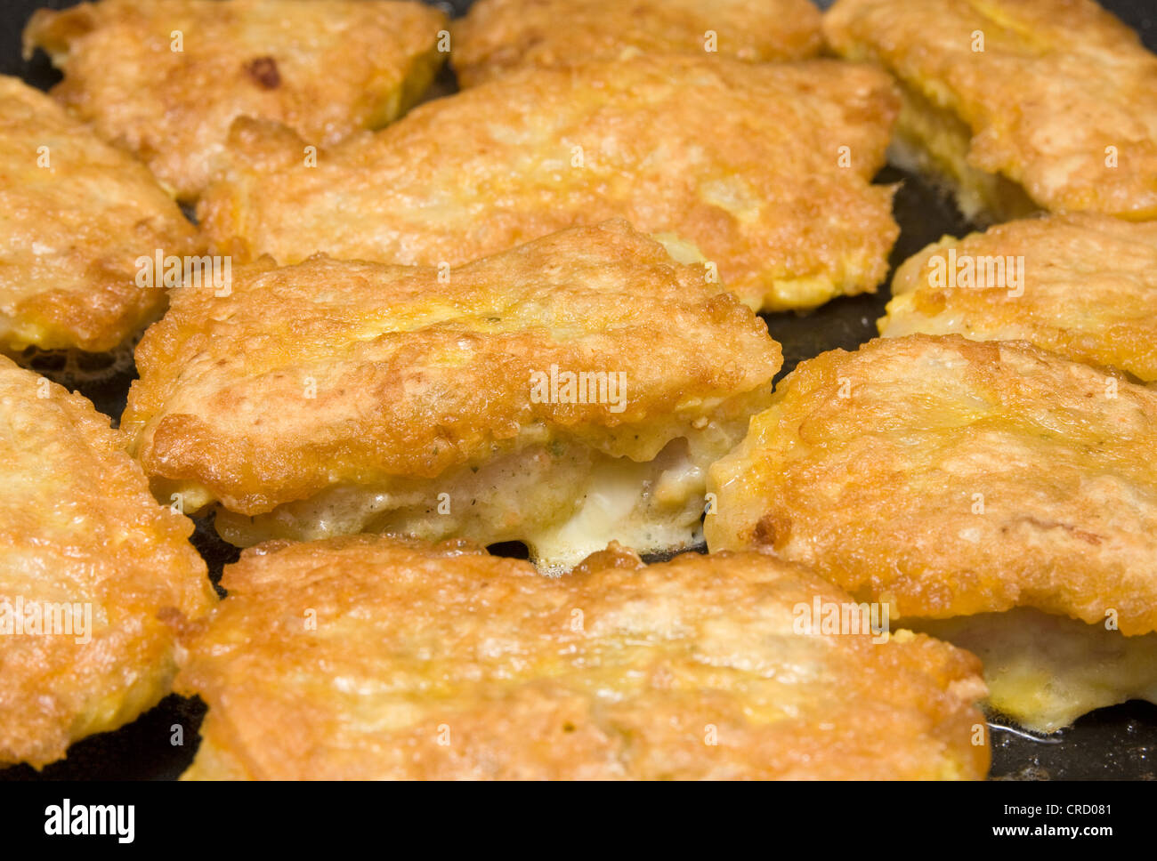 fish fillets roasting in the frying pan Stock Photo - Alamy