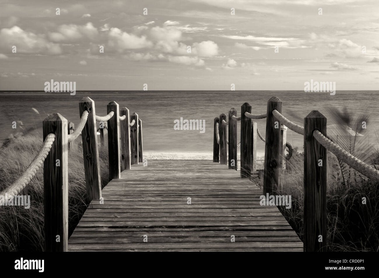 Board pathway to ocean. Grace Bay, Providenciales. Turks and Caicos. Stock Photo