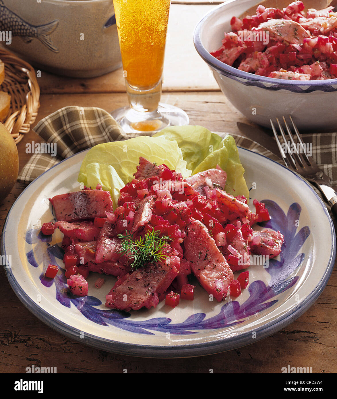 Red herring salad, mild young herring, beetroot and apple pieces in a fine dill dressing, Germany. Stock Photo