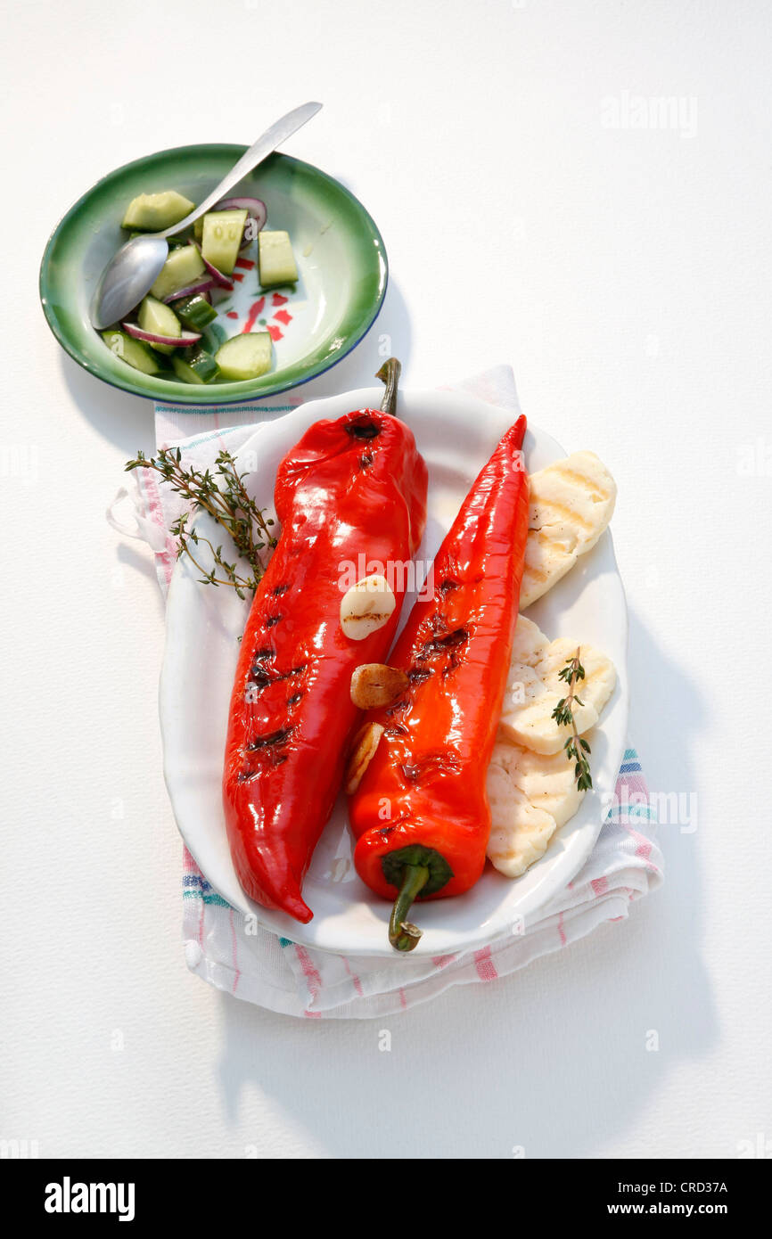 Grilled pointed pepper with Halloumi and cucumber salad Stock Photo