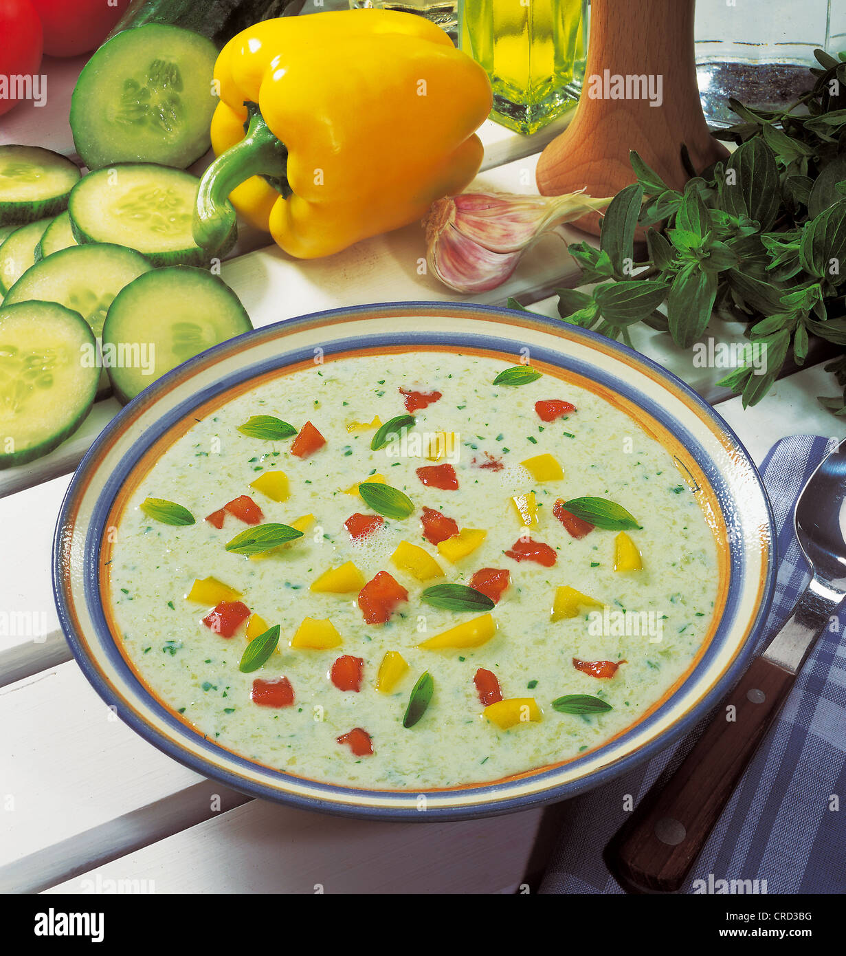 Cold cucumber soup from Hellas, well chilled, spicy, with cucumber, yogurt and fresh mint, garnished with bell pepper and tomato Stock Photo