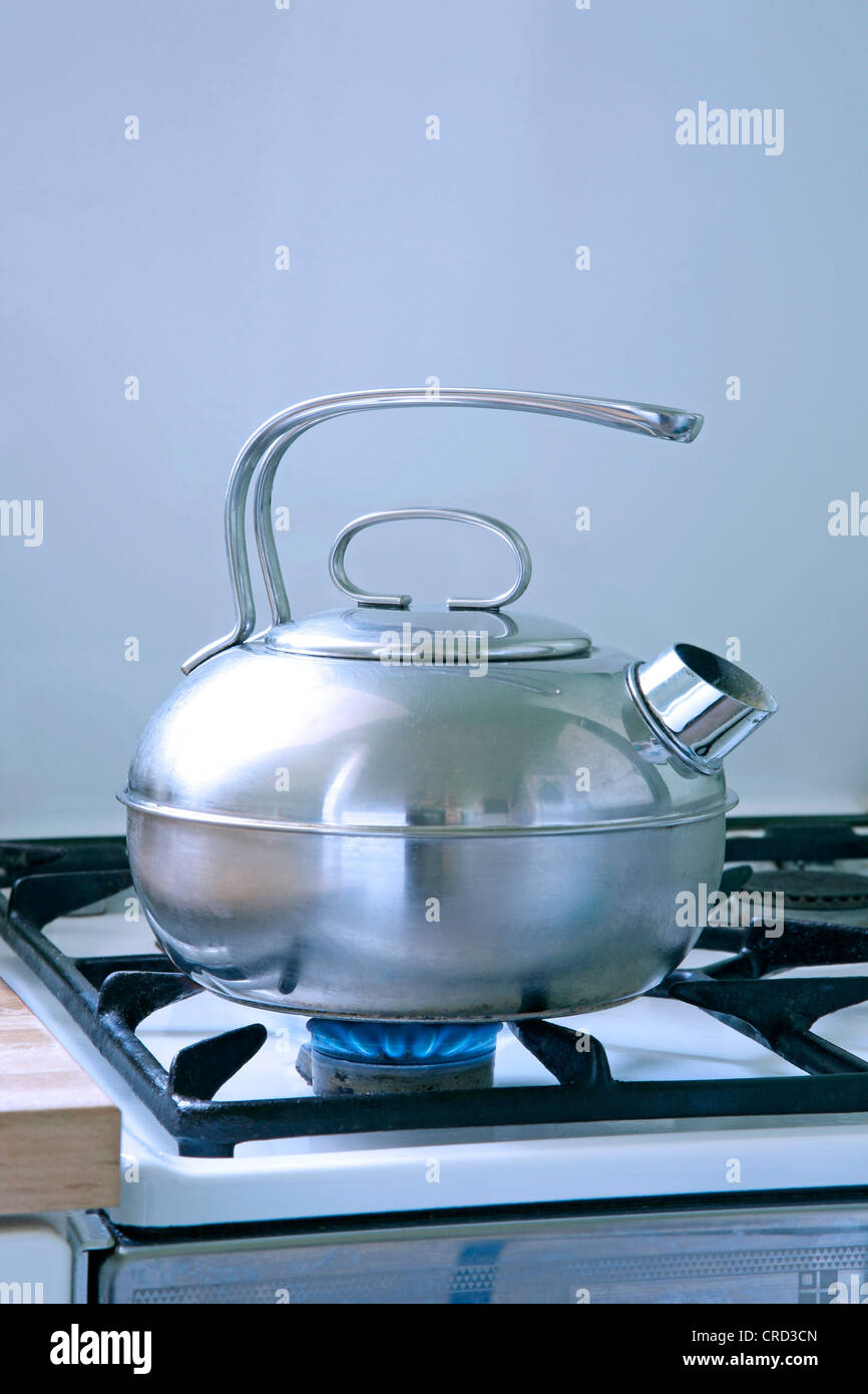 Kettle on gas stove Stock Photo Alamy