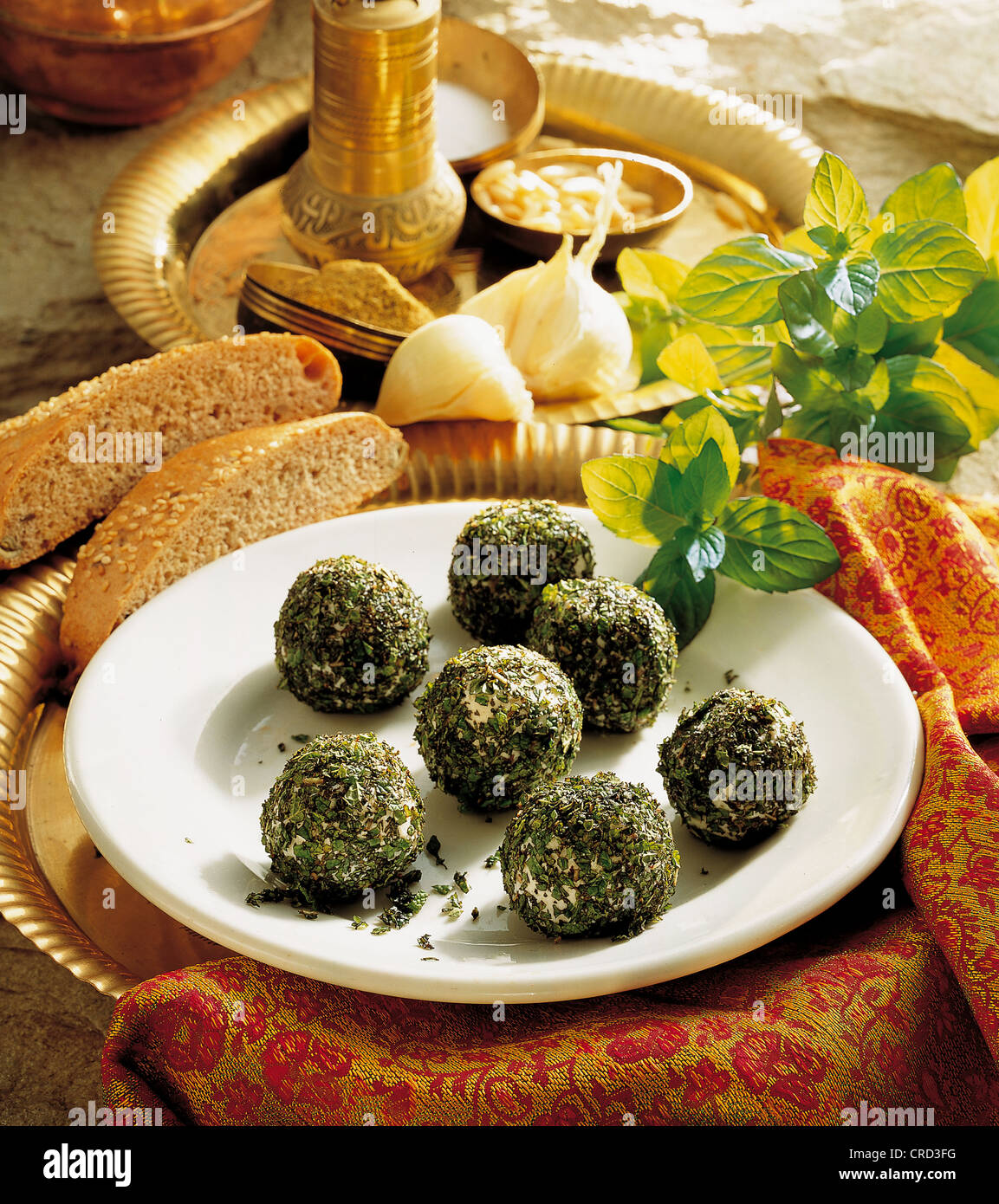 Lebanese cheese balls, feta cheese, goat's cheese and full-fat cream cheese with pine nuts in finely chopped mint, cold starter Stock Photo