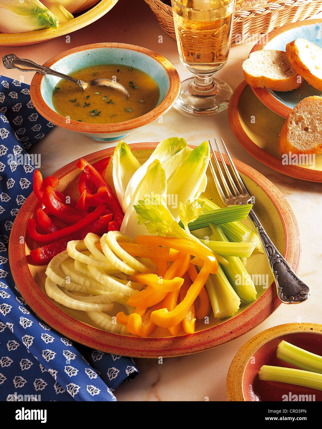 Crudités with anchovy dip, fennel, peppers, celery and chicory, cold starter, France. Stock Photo