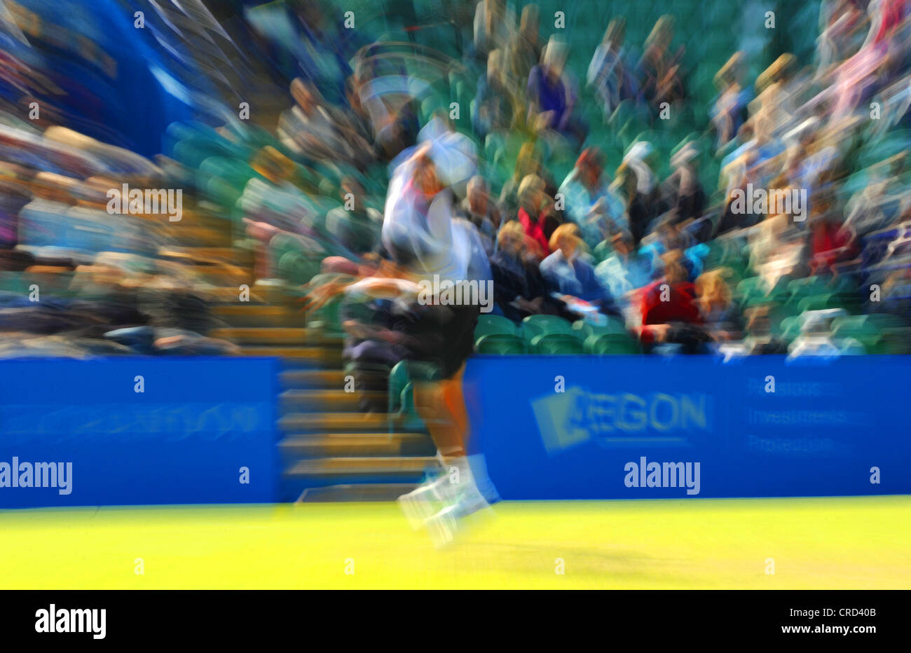 Blur effect image of male tennis player in action at Devonshire Park Eastbourne for the Aegon International Tournament Sussex UK Stock Photo