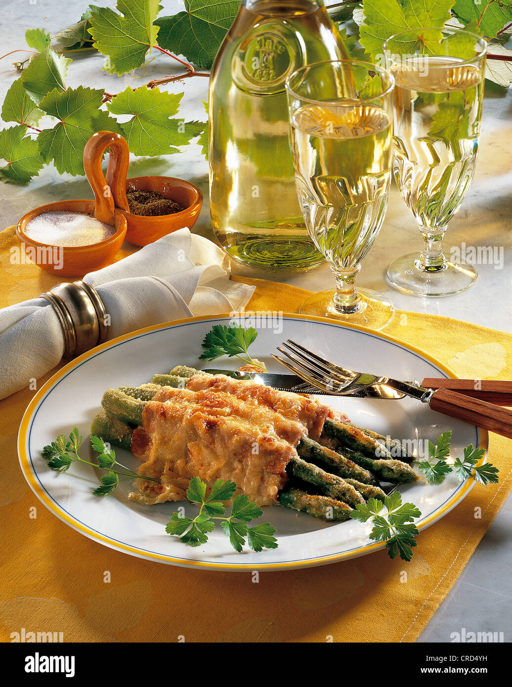 Green asparagus scalloped with Parmesan and Gruyère cheese, USA. Stock Photo