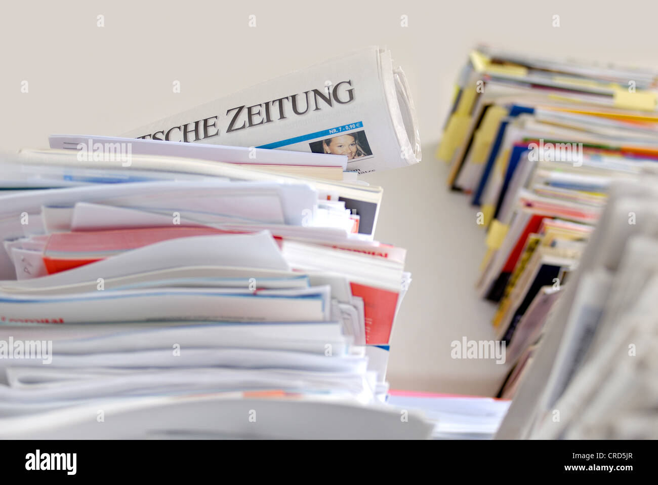 rolled newspaper in the post Stock Photo Alamy