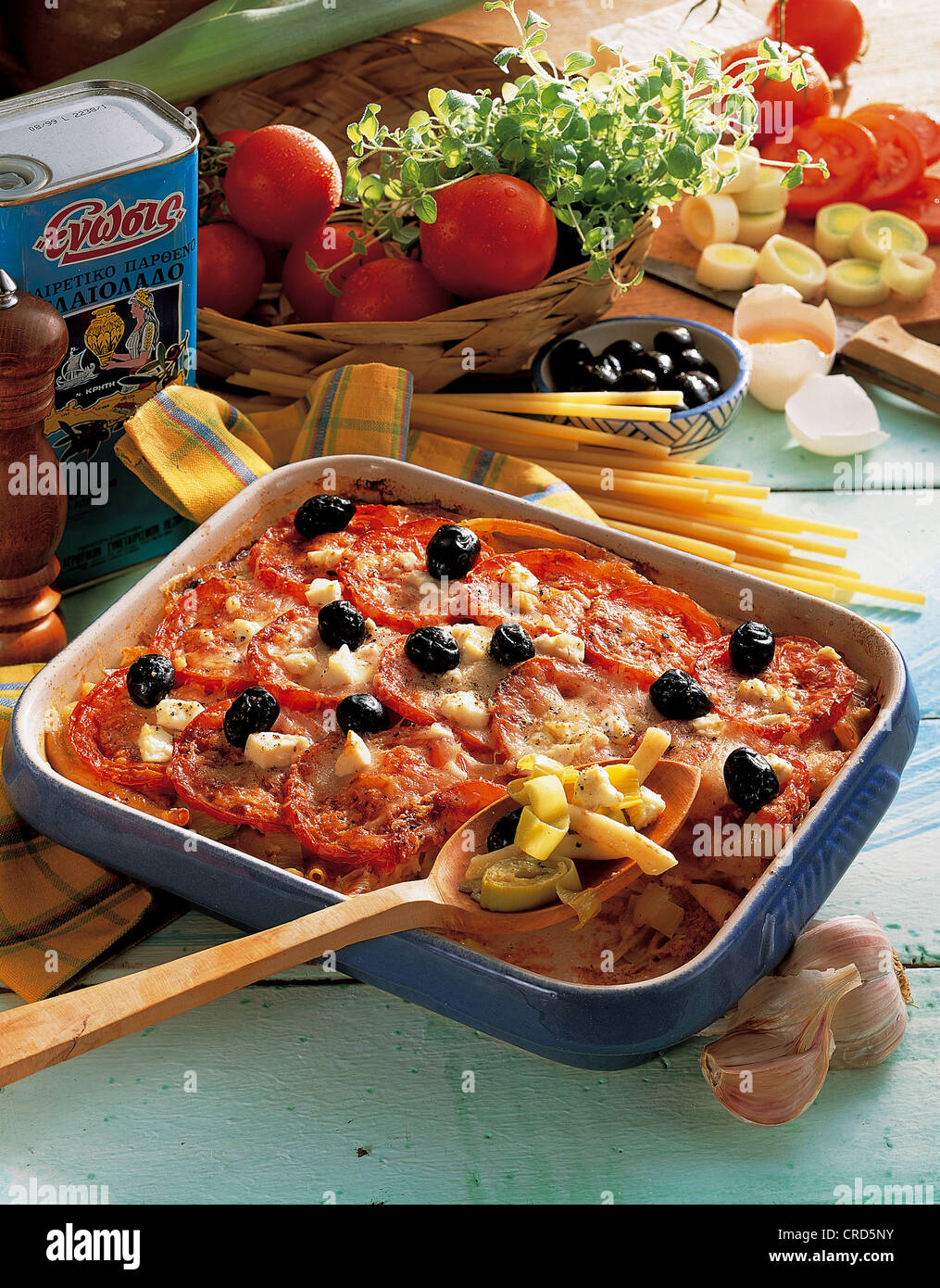 Casserole with noodles, leek, tomatoes, feta cheese and olives, Greece. Stock Photo