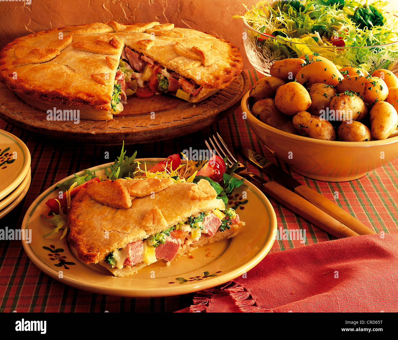 Ham and carrot pie, pastry filled with carrots, broccoli, ham and processed cheese, USA. Stock Photo