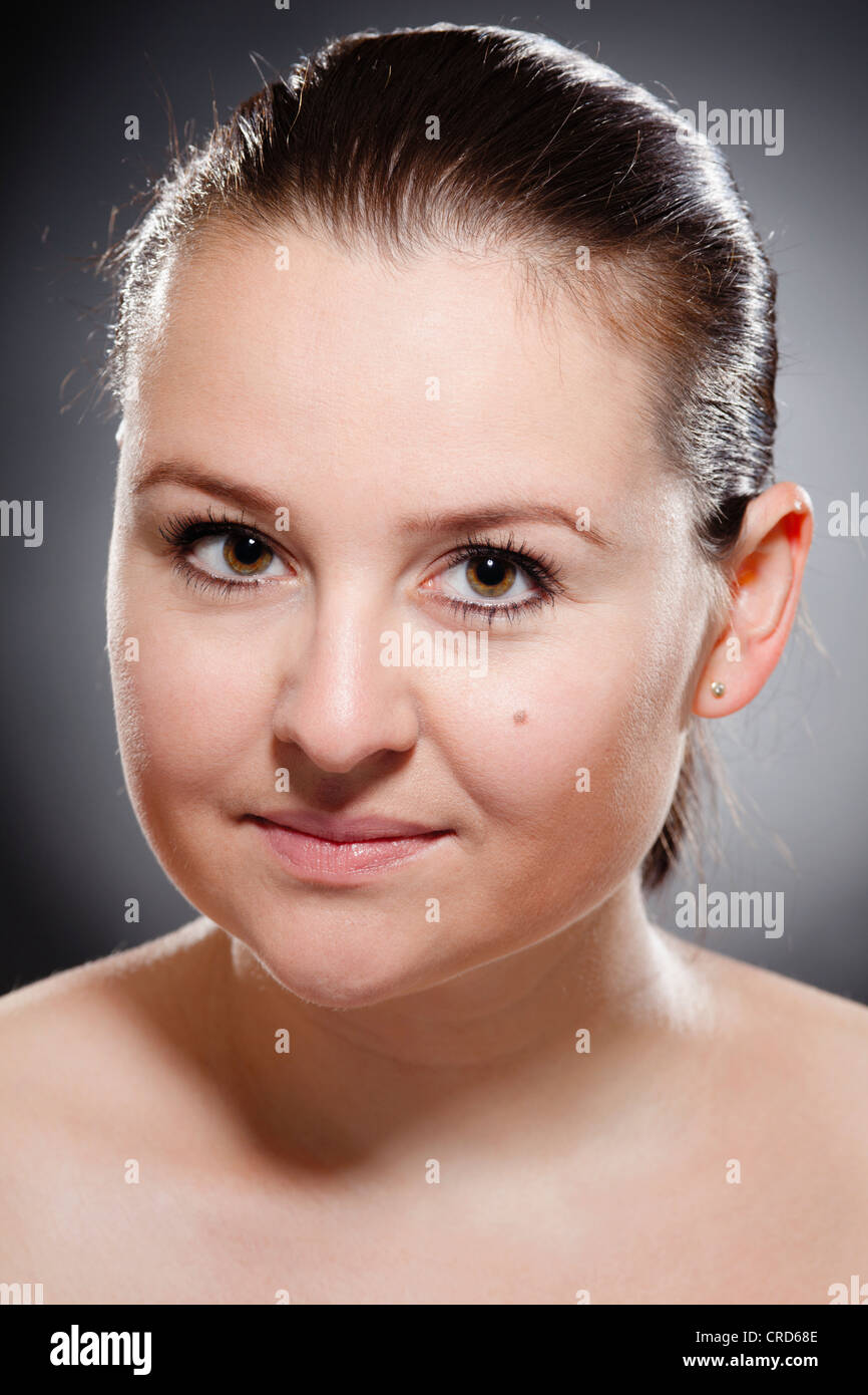 Young woman with suspicious look Stock Photo