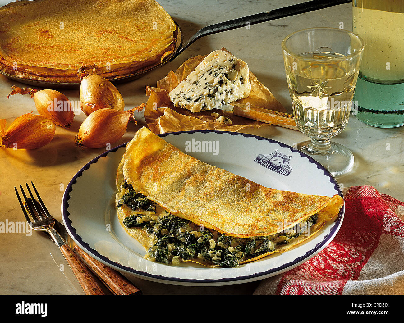 Crepes with a creamy stuffing made of Roquefort and silverbeet, France. Stock Photo