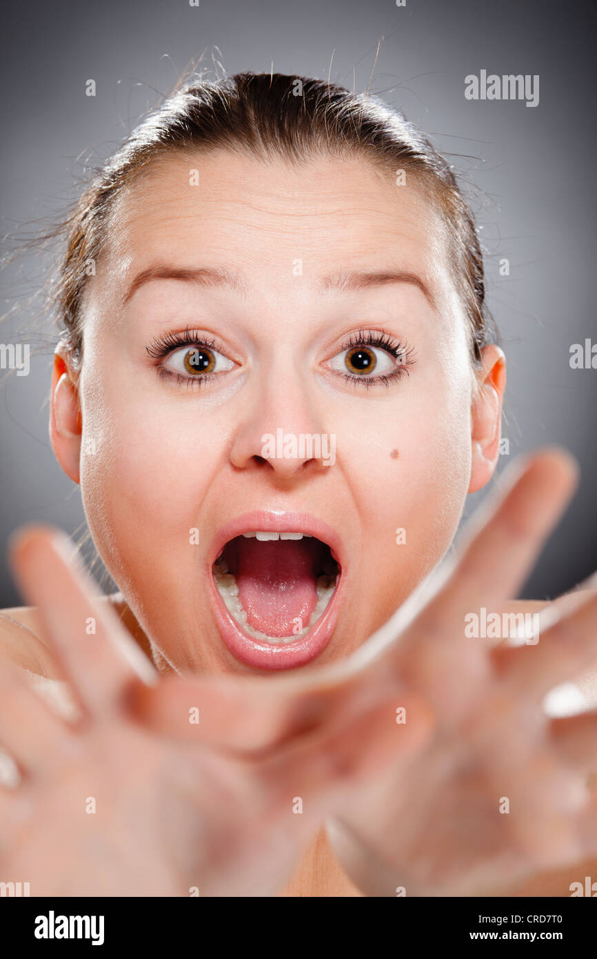 Young woman yells stop Stock Photo