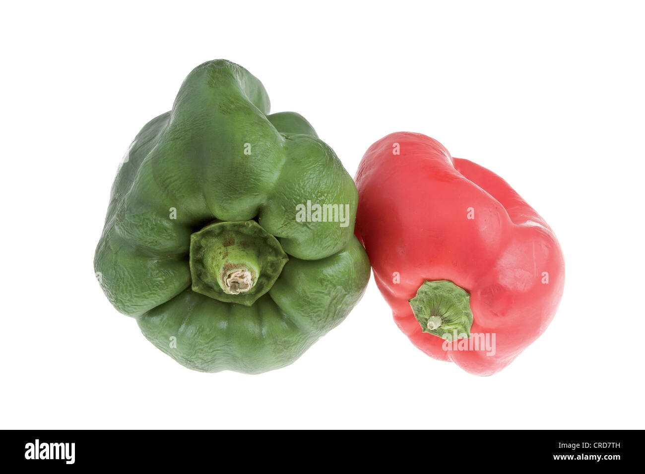 Green and red peppers on white background Stock Photo - Alamy
