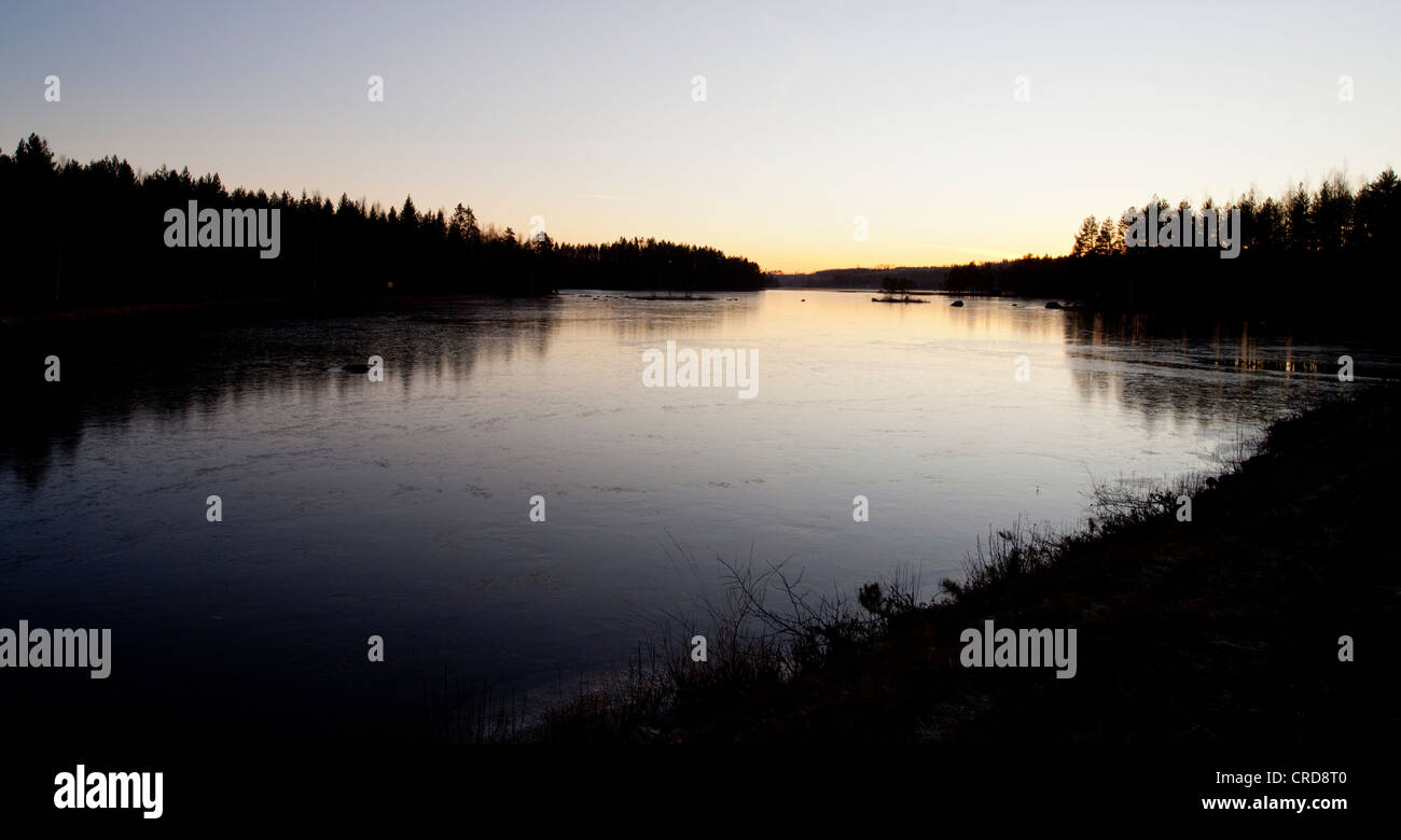 First ice on lake surface at Autumn , Finland Stock Photo