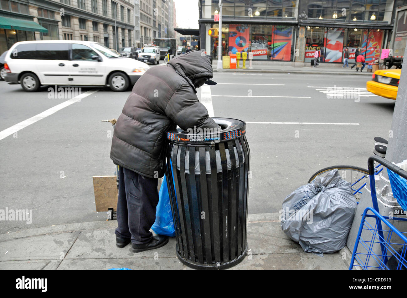 homeless-person-searching-in-a-dustbin-for-utilizable-things-usa-new-CRD913.jpg