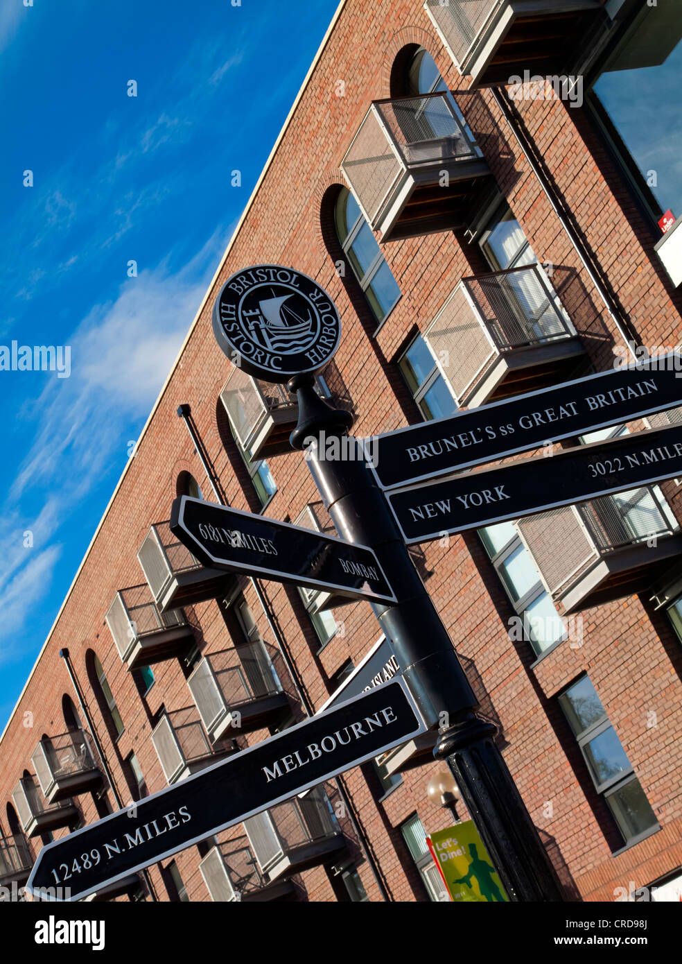Modern flats and tourist sign in Bristol Docks and Harbour area in city