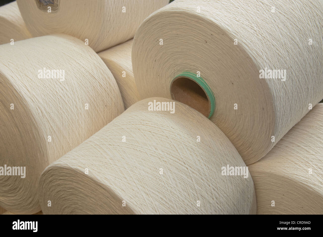 Cotton yarn on large spools Stock Photo