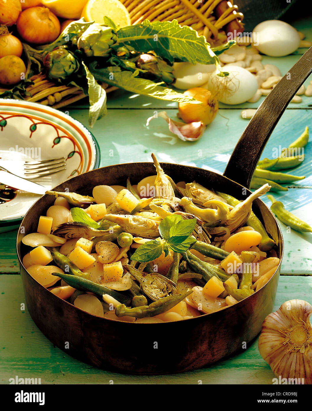 Bean soup with okra and baby artichokes, vegetarian stew, Greece. Stock Photo