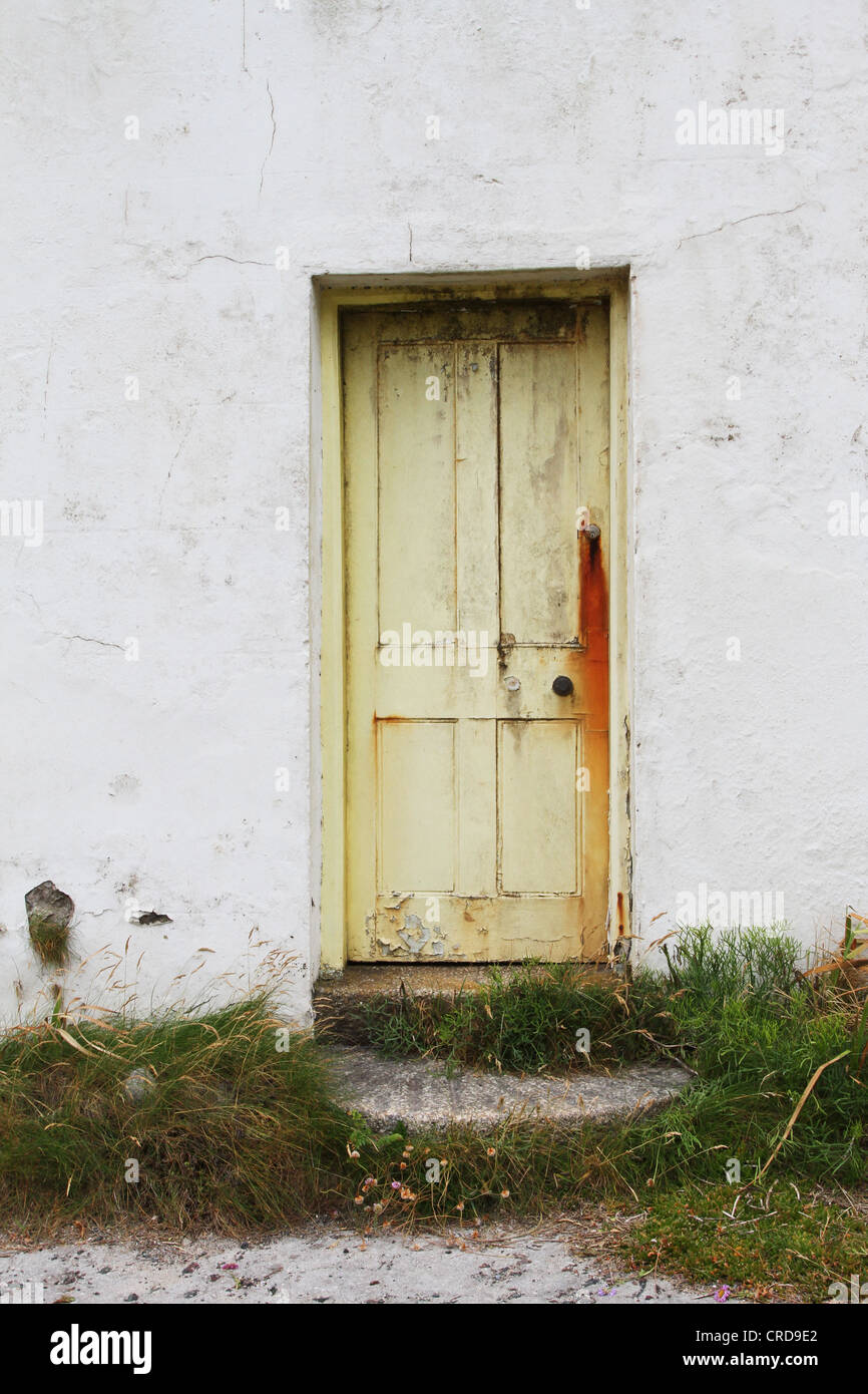 Old weathered door in a delapidated building Stock Photo