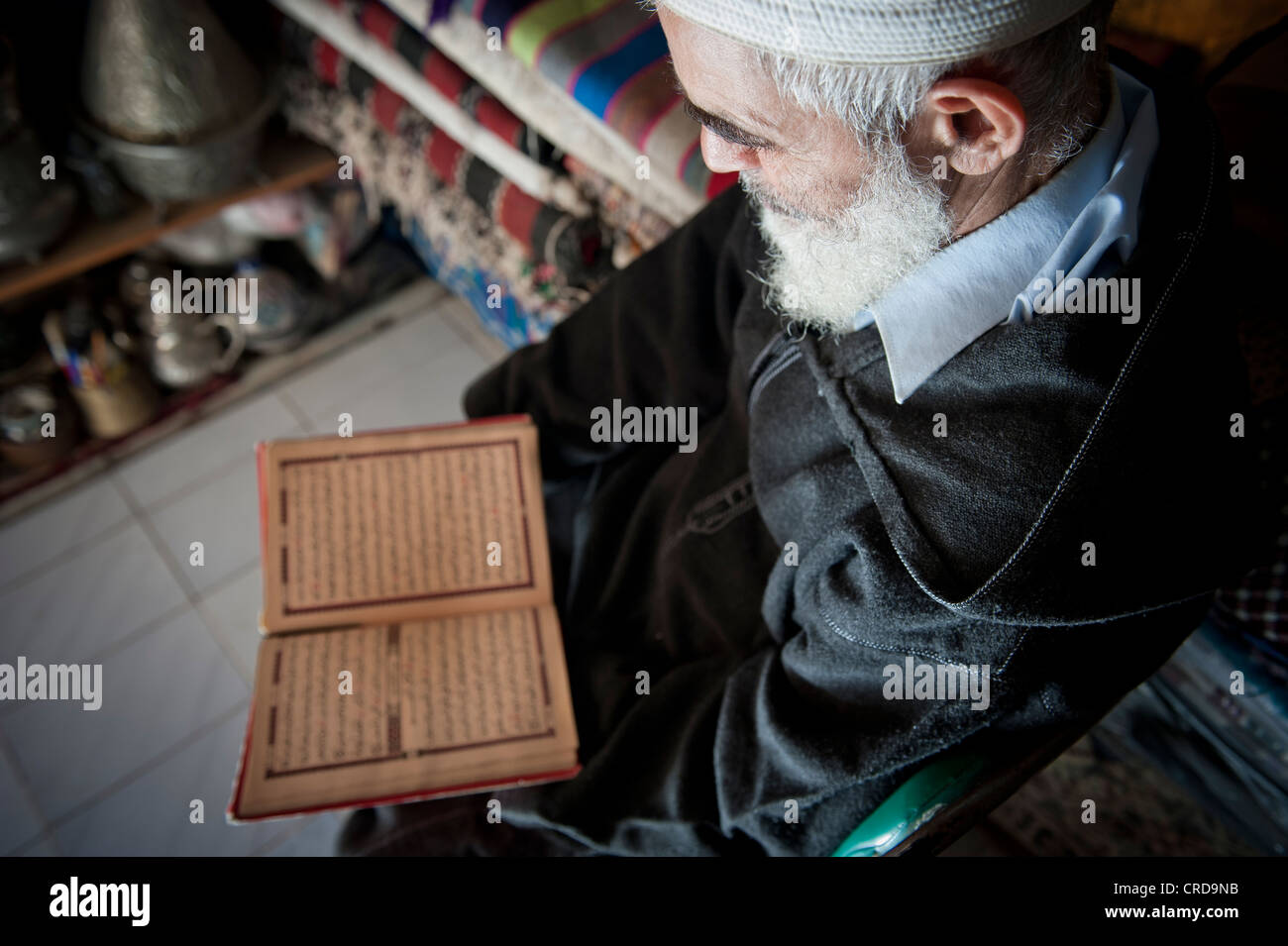 Muslim man reading the Quran, Fez, Morocco. Stock Photo