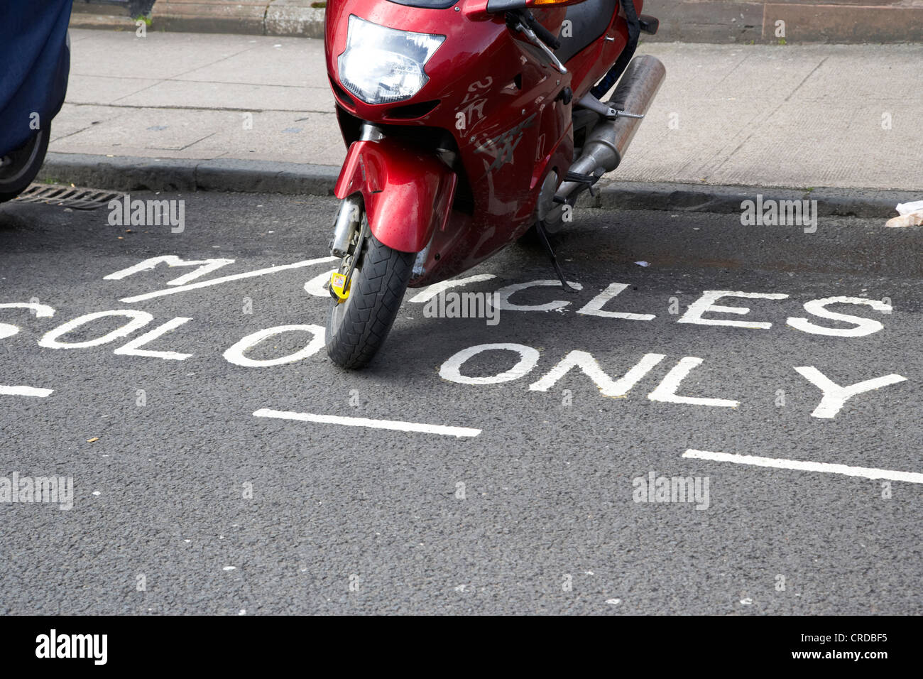 motorbike parked in a solo motorcycles only parking space in glasgow scotland uk Stock Photo