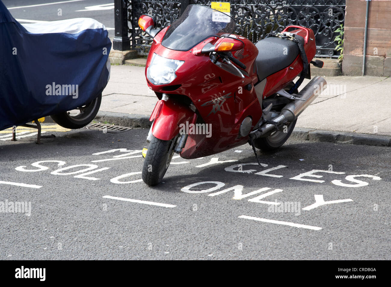 motorbike parked in a solo motorcycles only parking space in glasgow scotland uk Stock Photo