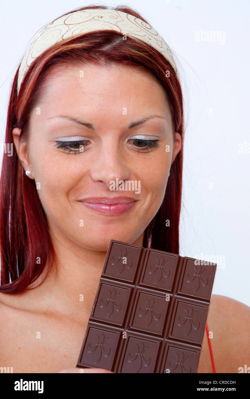 young woman with chocolate bar Stock Photo Alamy