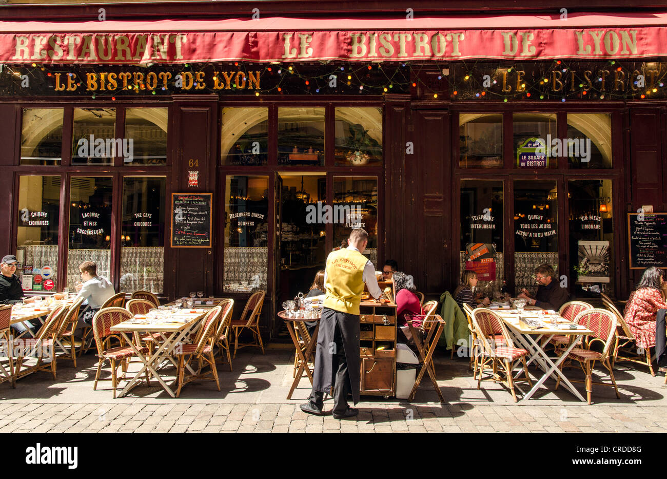 People enjoying the sun in an outdoor bar Lyon France Europe Stock Photo