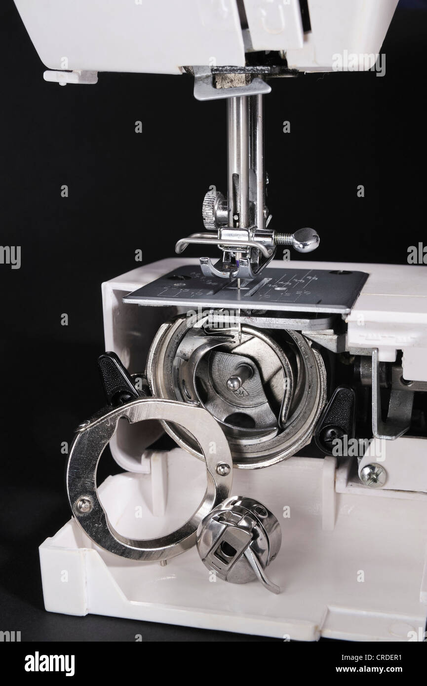 Sewing machine with presser foot, open cover, bobbin case Stock Photo Alamy