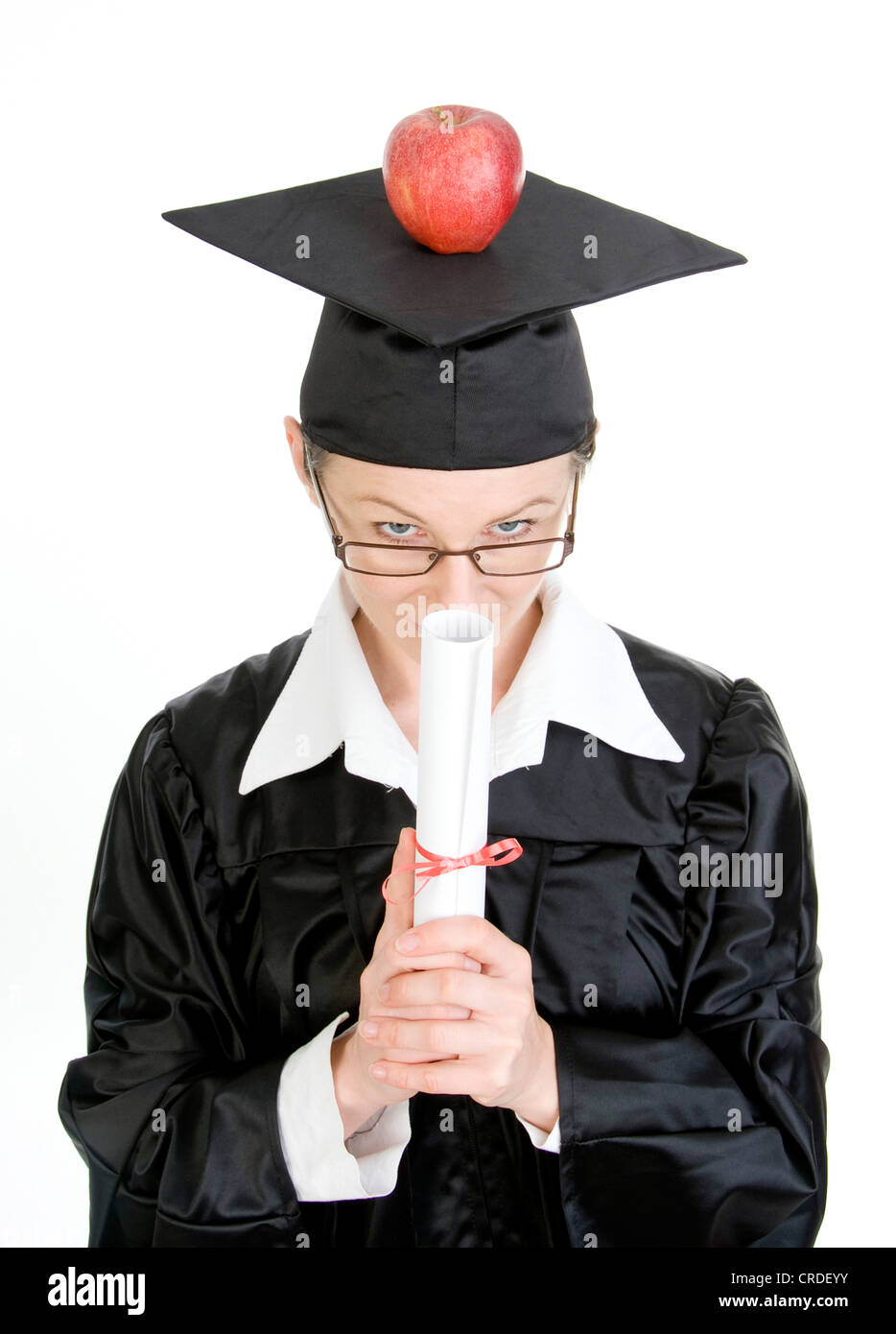 symbolic for brainfood, degree holder with apple Stock Photo