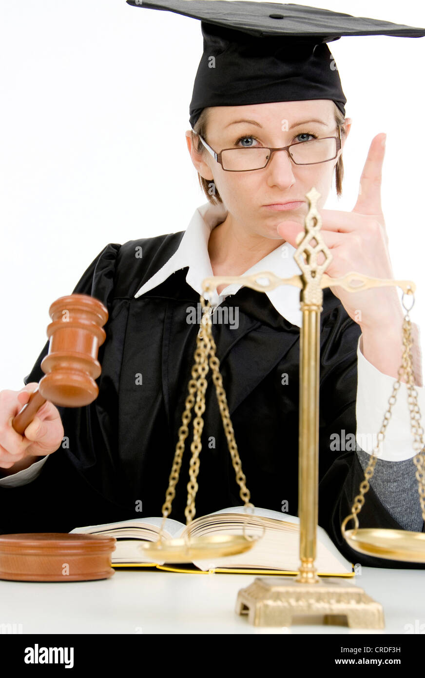 female judge with scale, code and mallet, warning Stock Photo