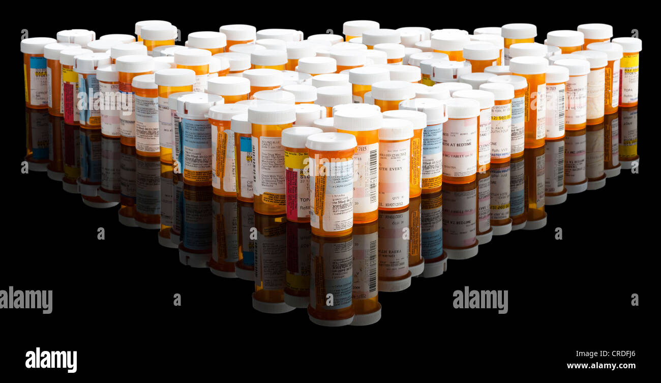 Multiple prescription bottles on black Stock Photo