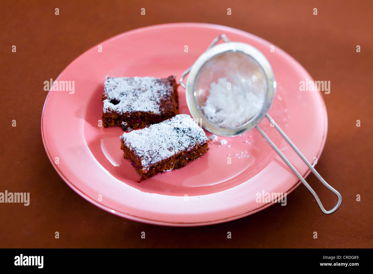 Chocolate brownies with icing sugar Stock Photo Alamy