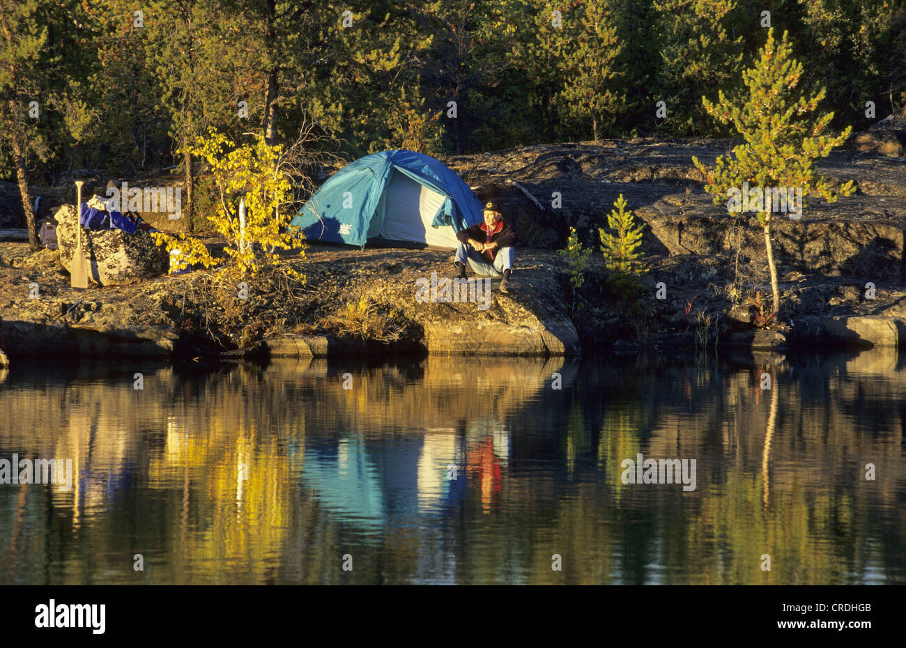 Man sitting on rock shore hi-res stock photography and images - Alamy