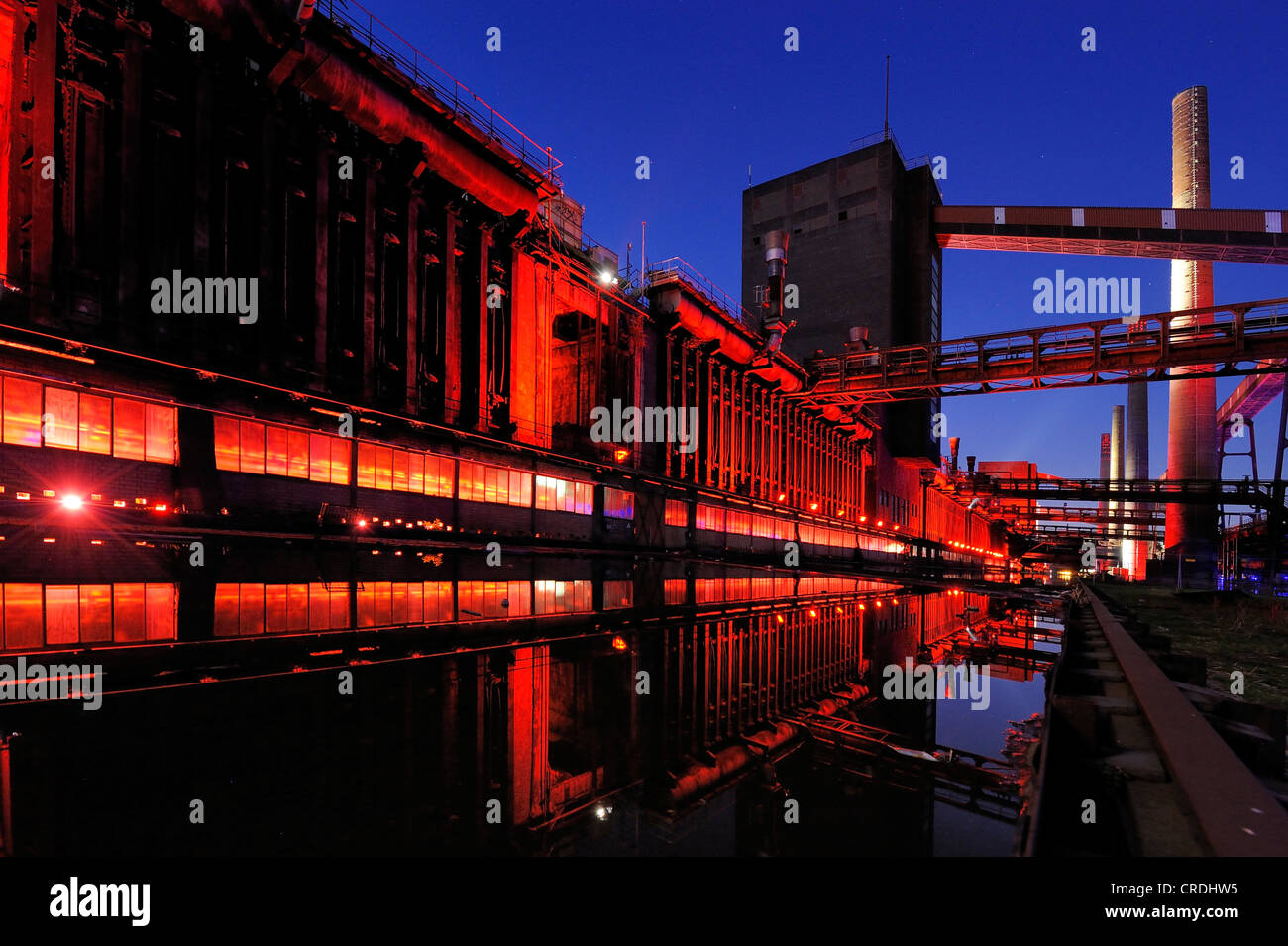 Industrial buildings illuminated at night, Zeche Zollverein Coal Mine, Essen, North Rhine-Westphalia, Germany, Europe Stock Photo