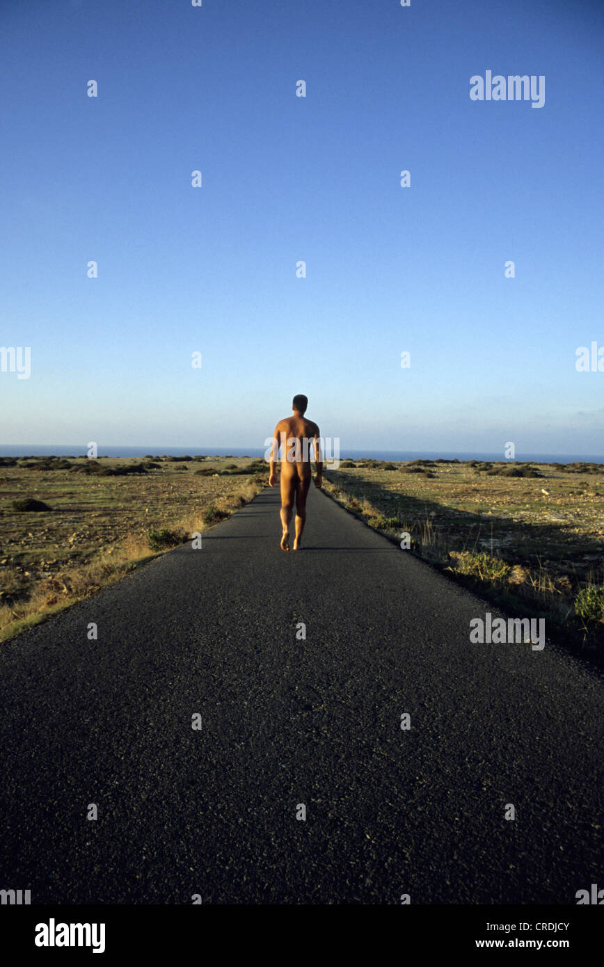 naked man walking on path, Spain, Balearen, Formentera Stock Photo - Alamy