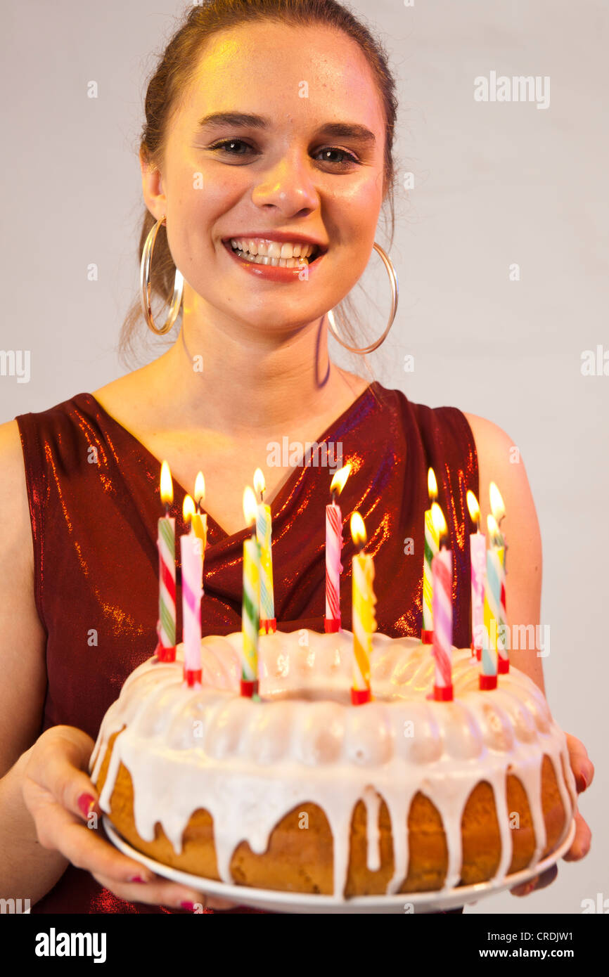 Young woman with birthday cake Stock Photo Alamy